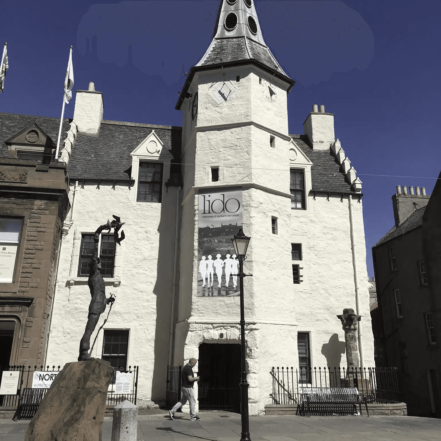 The outside of the Dunbar Townhouse with a banner on the outside advertising 'Lido".
