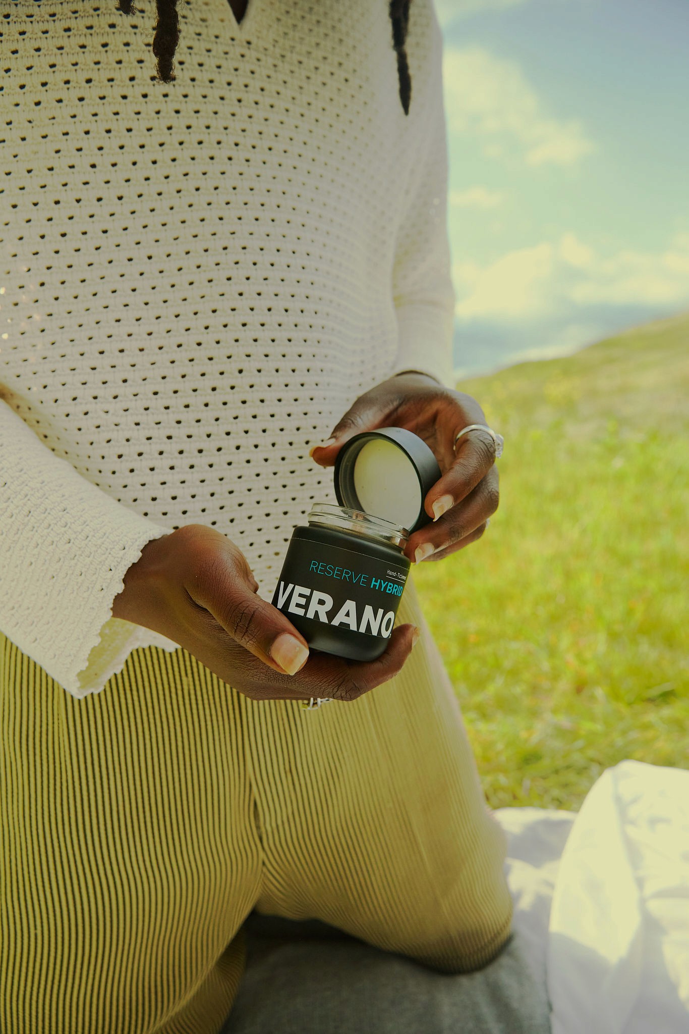 Woman with red hair covering mouth with hair