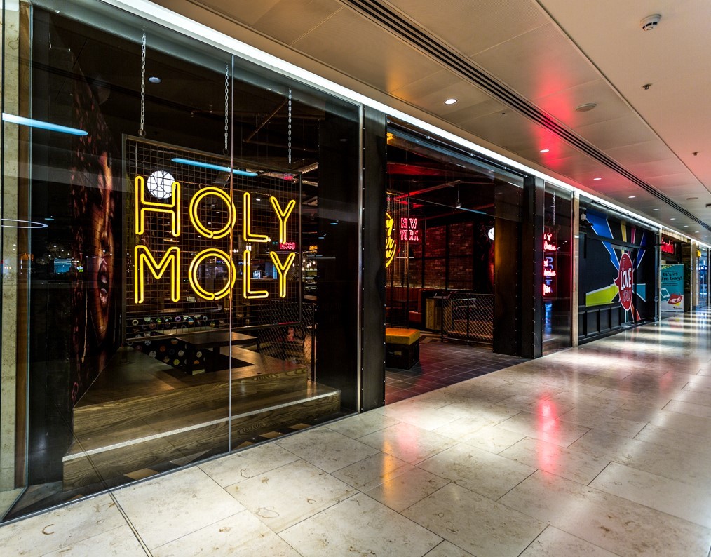 Holy Moly Macaroni restaurant storefront at Grand Central Birmingham with neon signage and shopfitting delivered by Matrix IDC