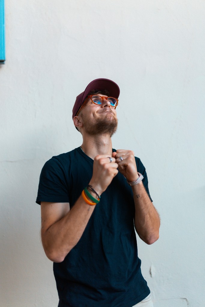 A man looking up thoughtfully, symbolizing customer **aspirations** and goals.