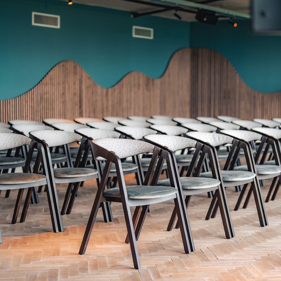 art deco styled bedroom with accsent mirror above the bed