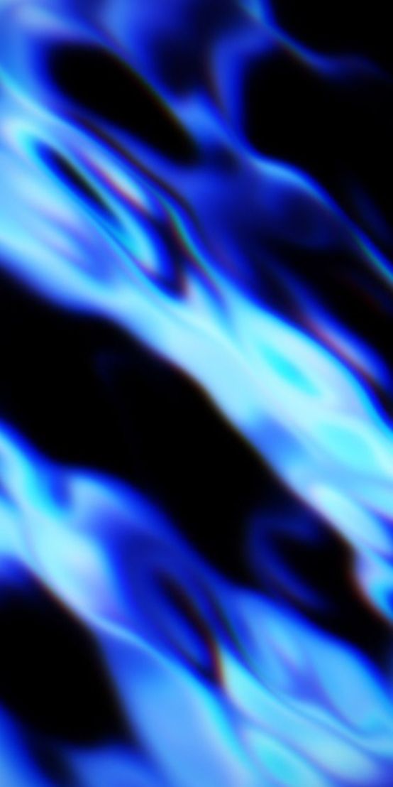 Layered blue mountains fade into a soft pink sky.