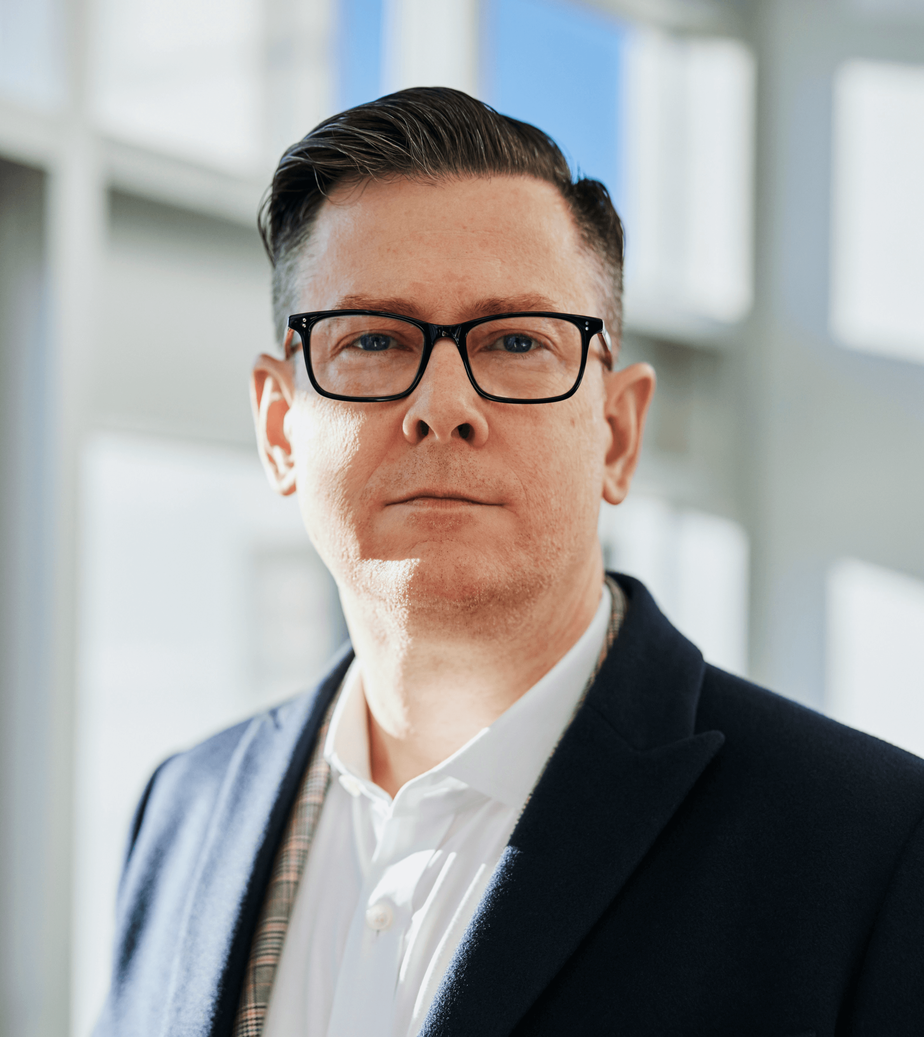 man standing beside wall