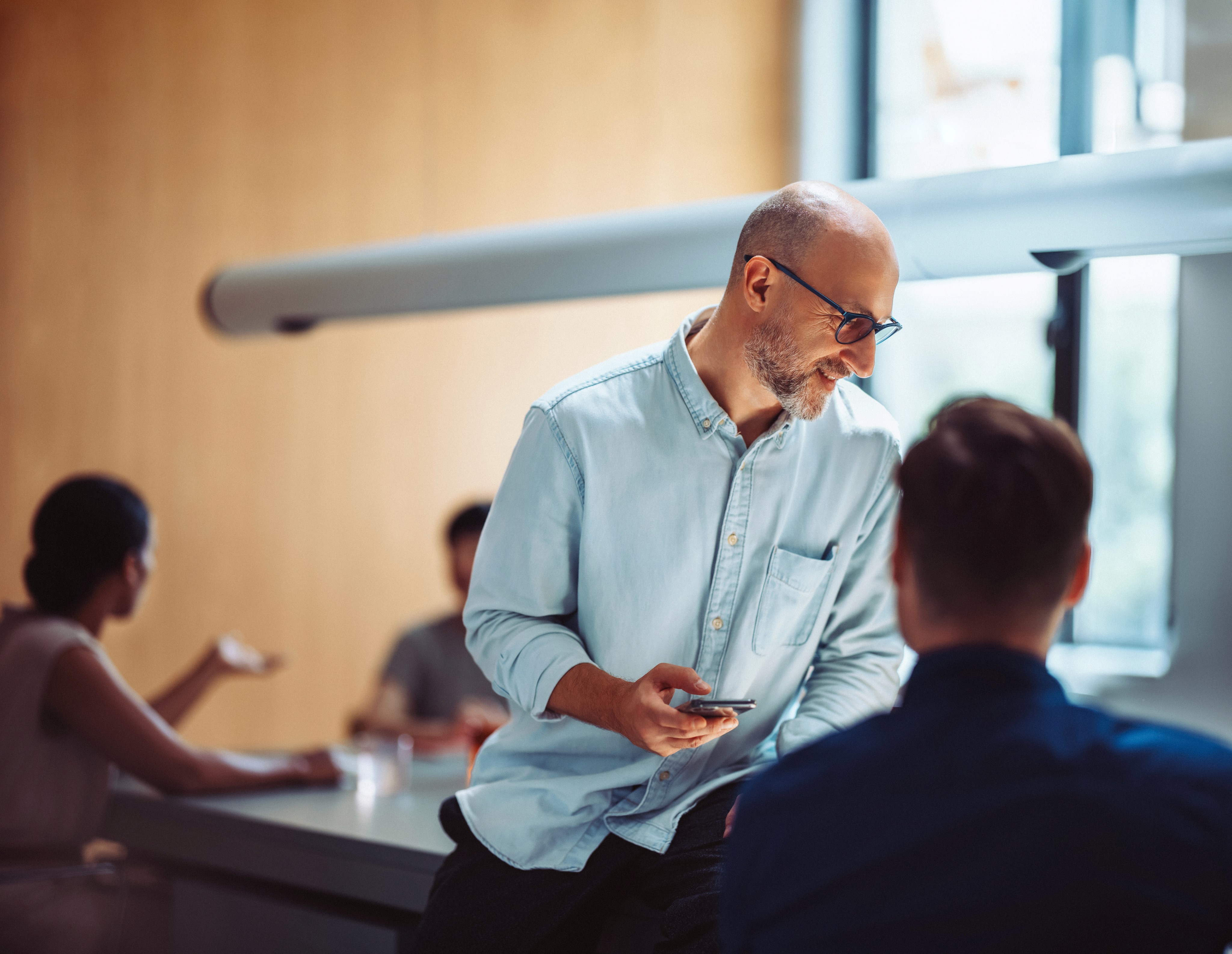 EB-1 visa lawyer in office consultation with clients