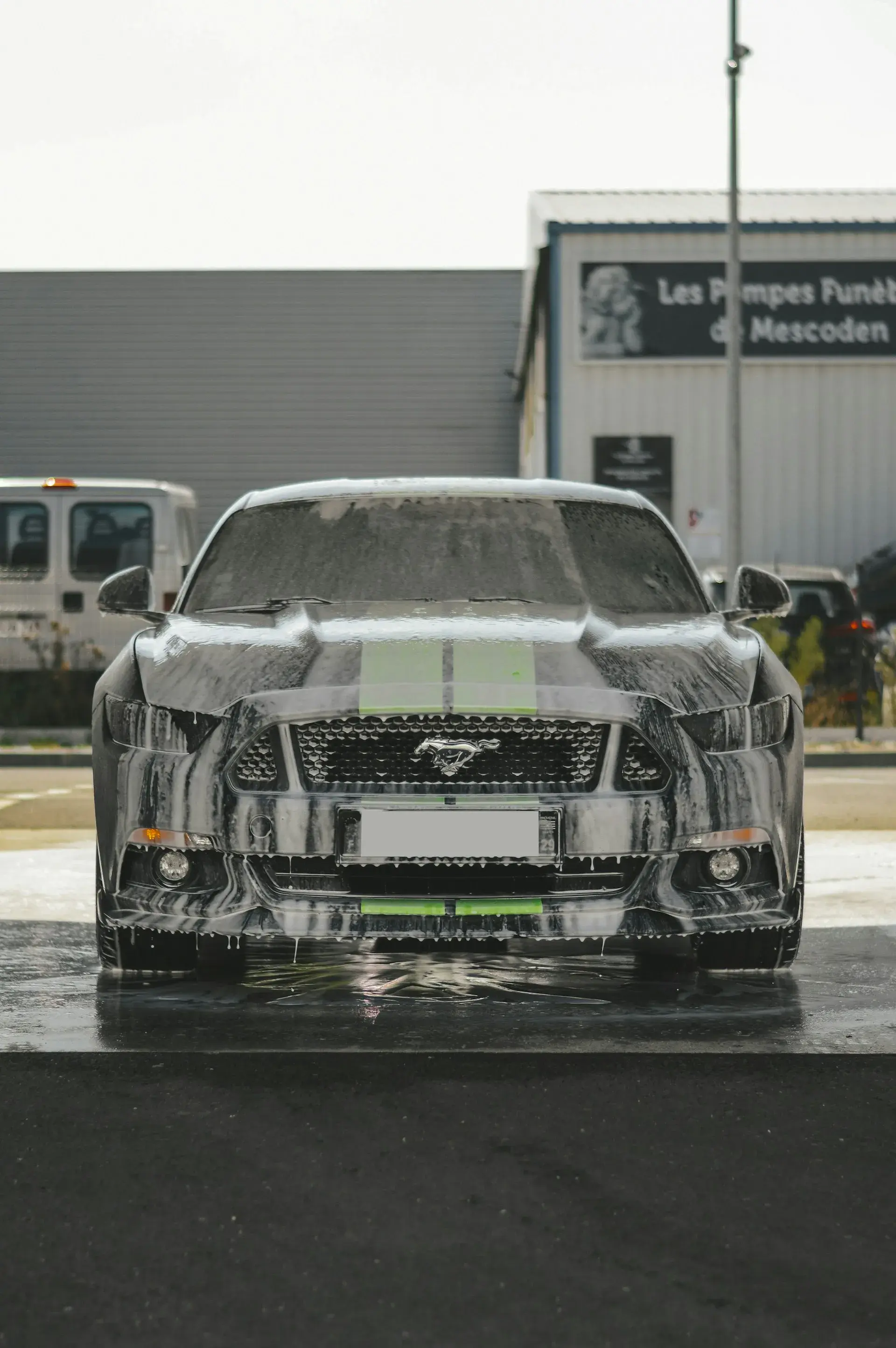 front view of a sports car with foam dripping off