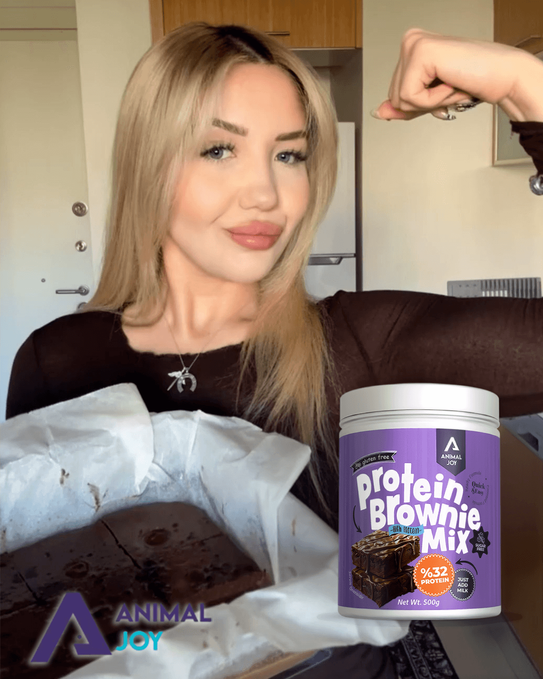 A woman in a teal dress sits in a dimly lit room, focused on her smartphone. A laptop and notepad are on the glass table, suggesting a working environment.