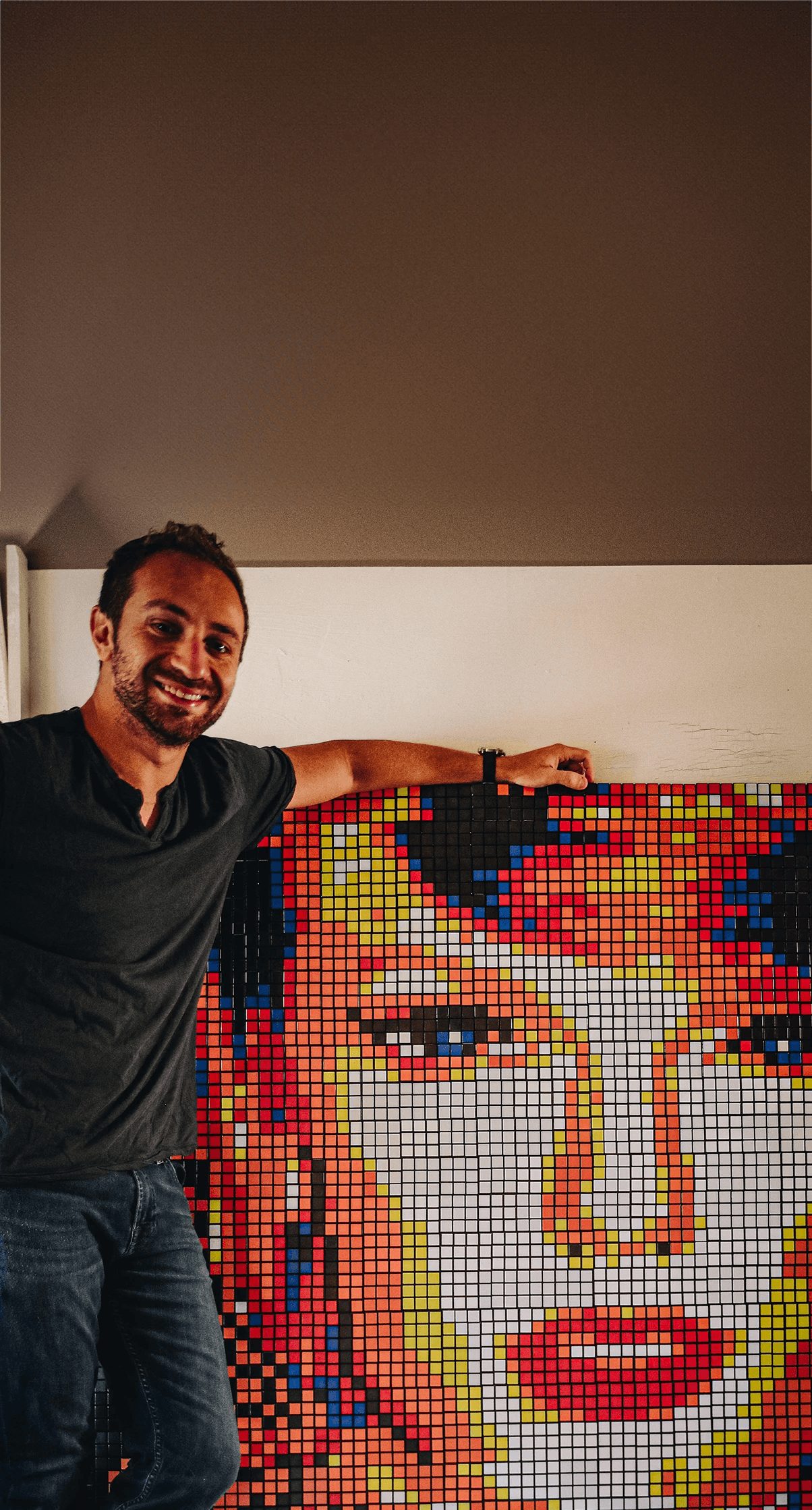 Artist with Rubik's cube mosaic, large-scale style