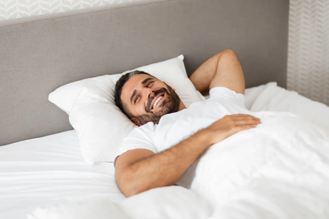 man waking up happy