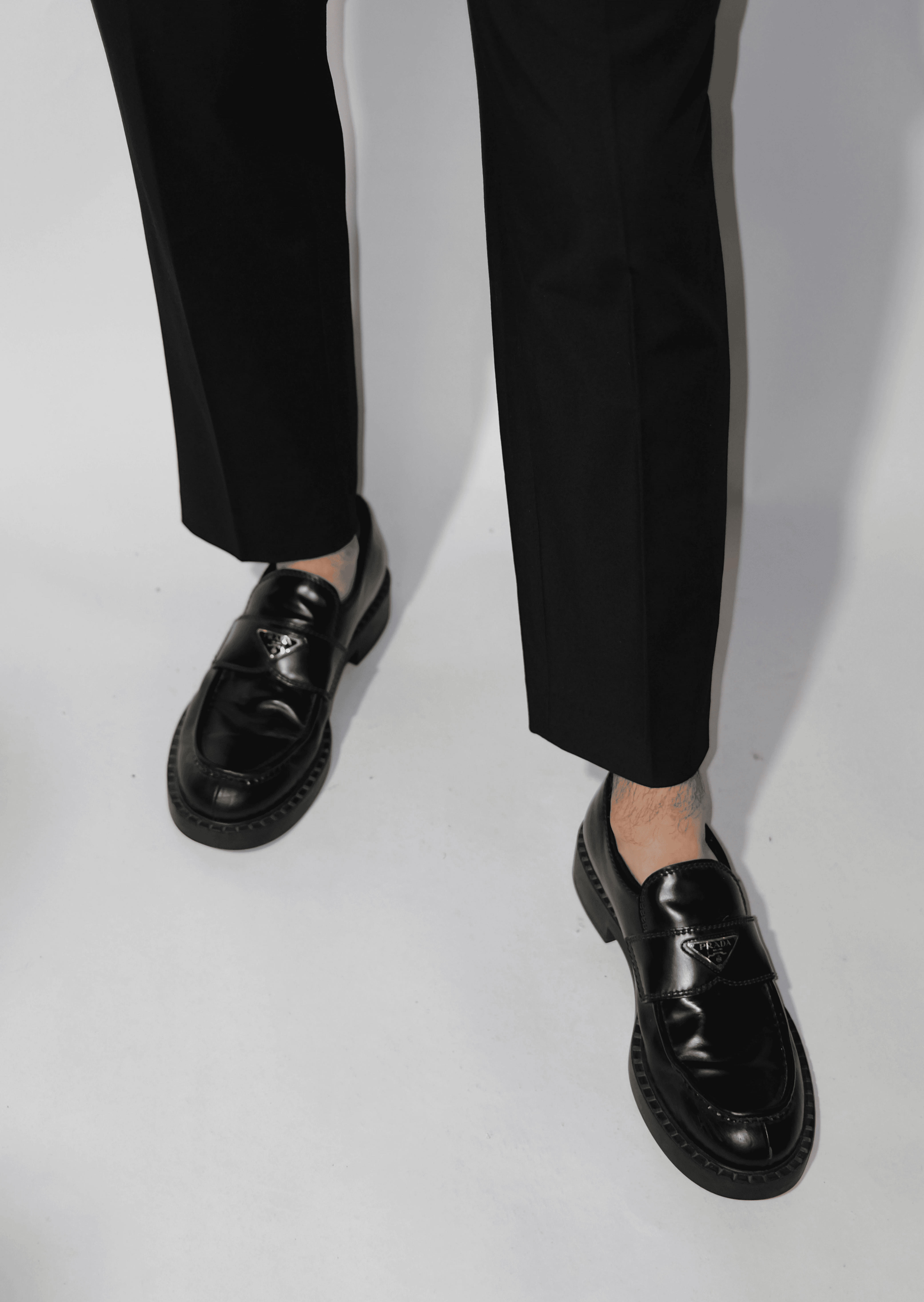 smiling man standing near green tree