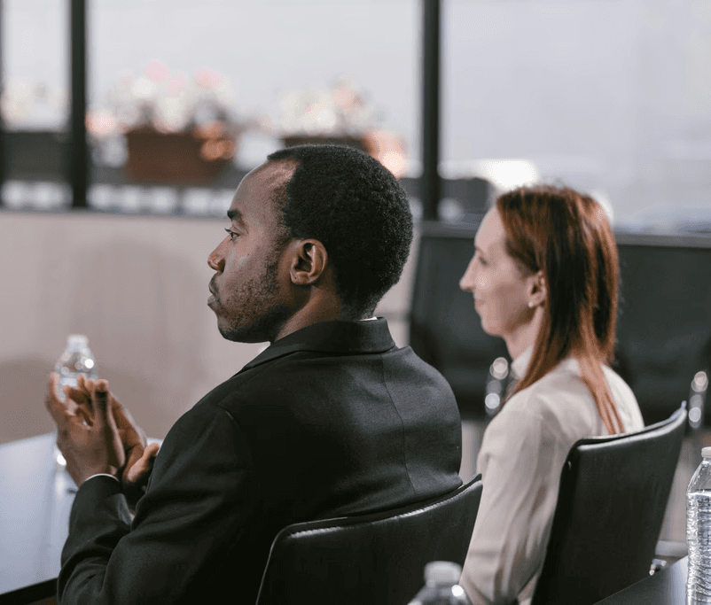 man in blue dress shirt beside man in white dress shirt