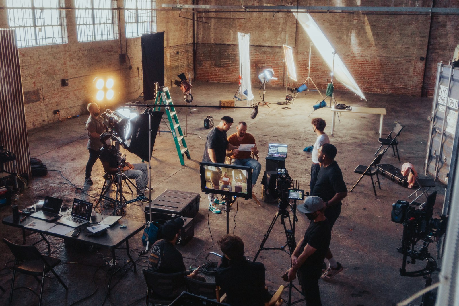 Production team assembled around a camera