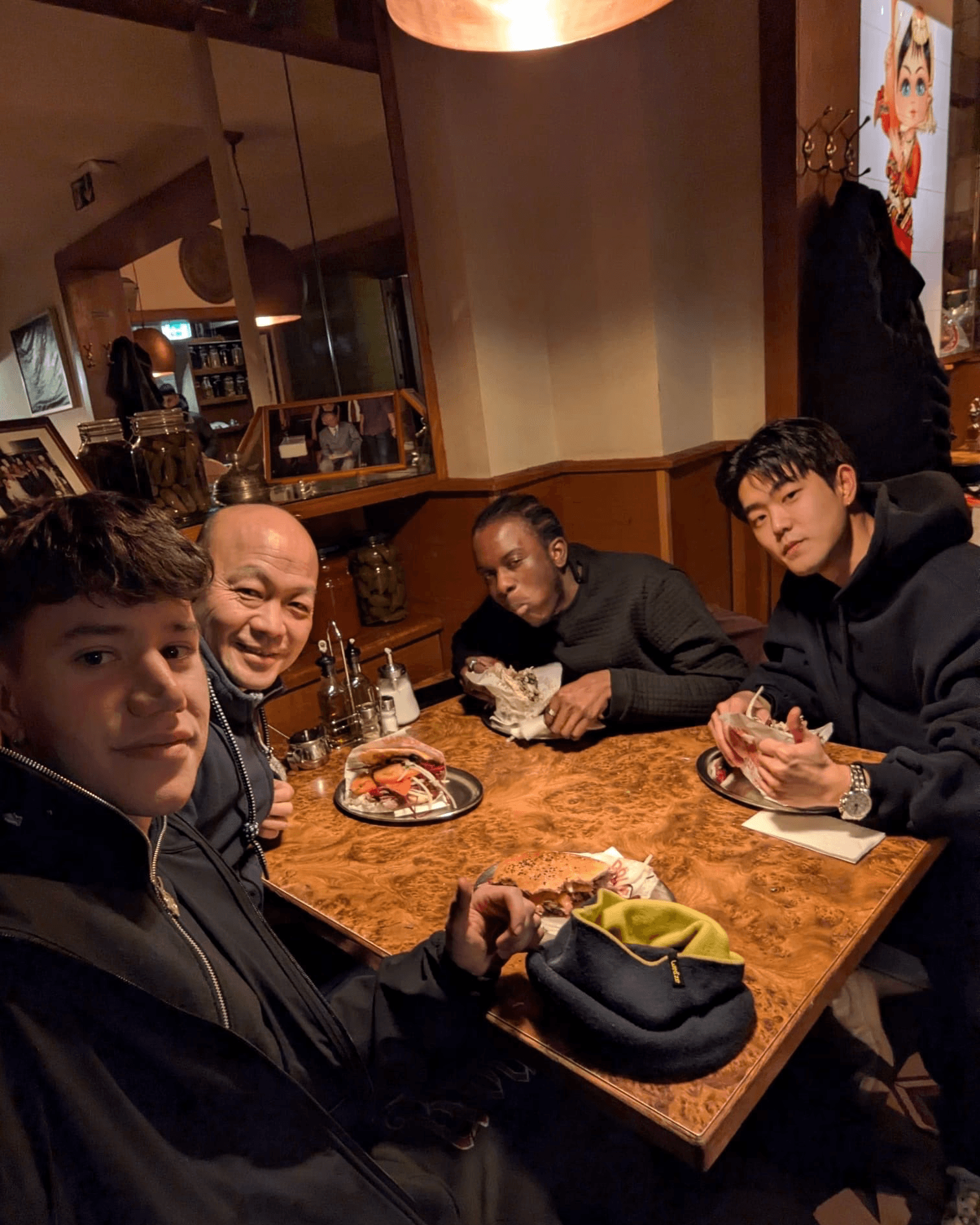 leafless tree on the field near the lake