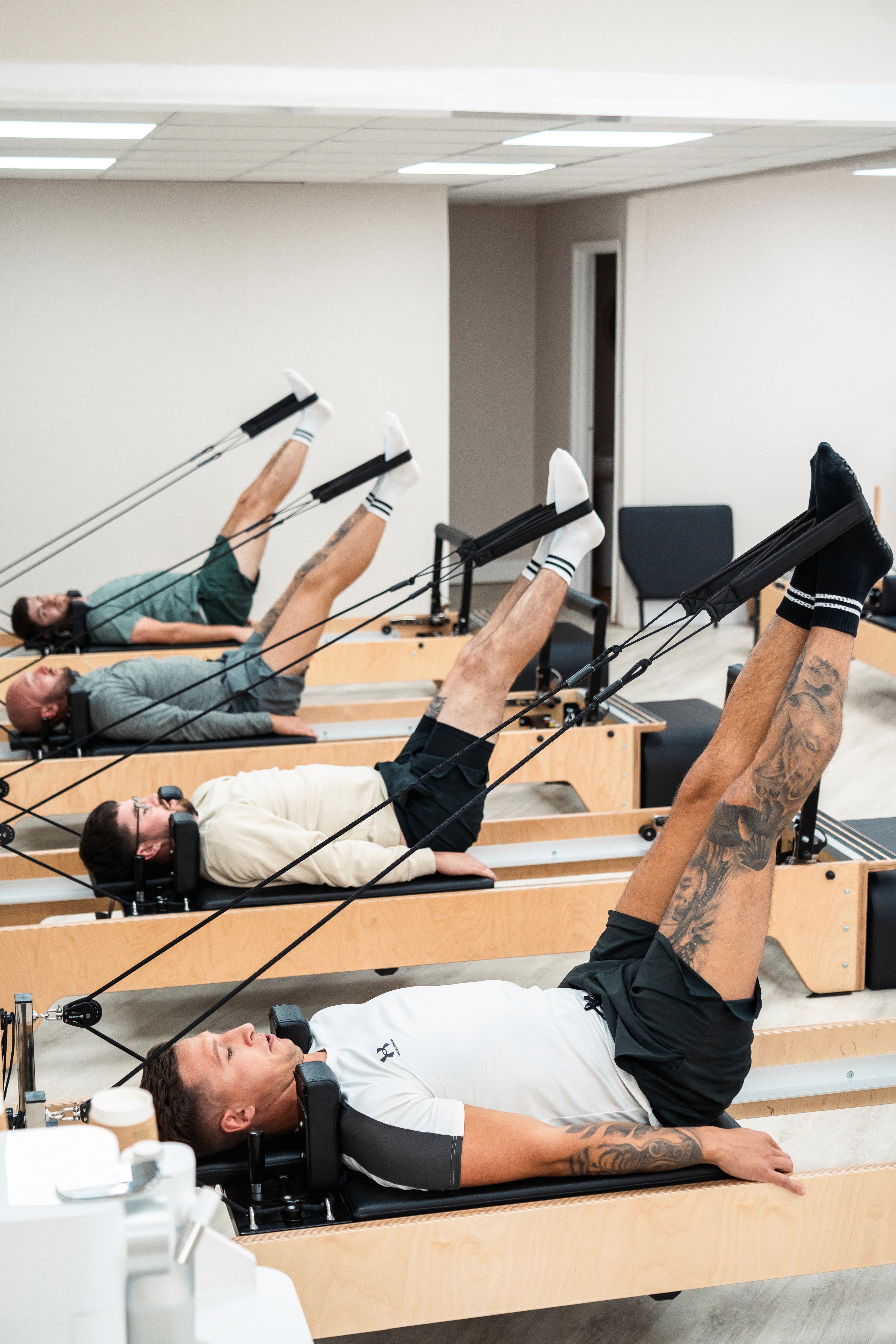 Live image of a reformer Pilates session at Rise and Reform.