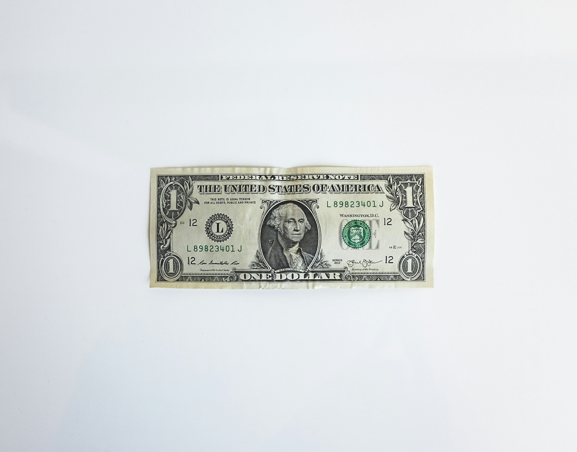 dollar bill on table - Anyword Alternative