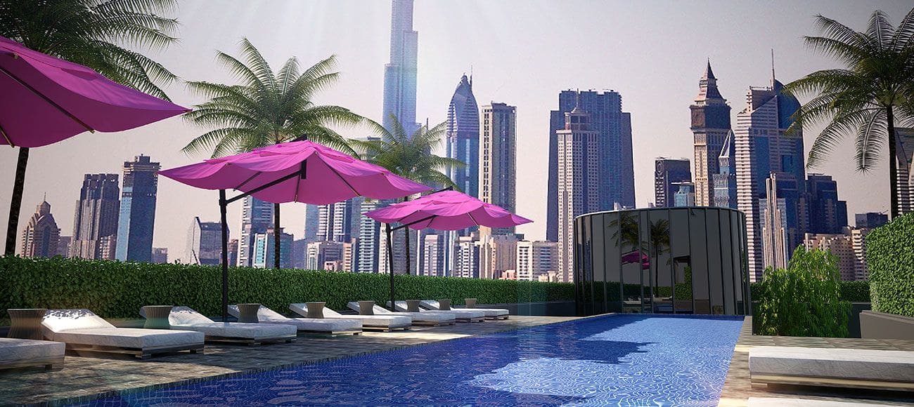 The Pad by OMNIYAT features a pool with lounge chairs and a sleek glass wall, creating an elegant outdoor space.