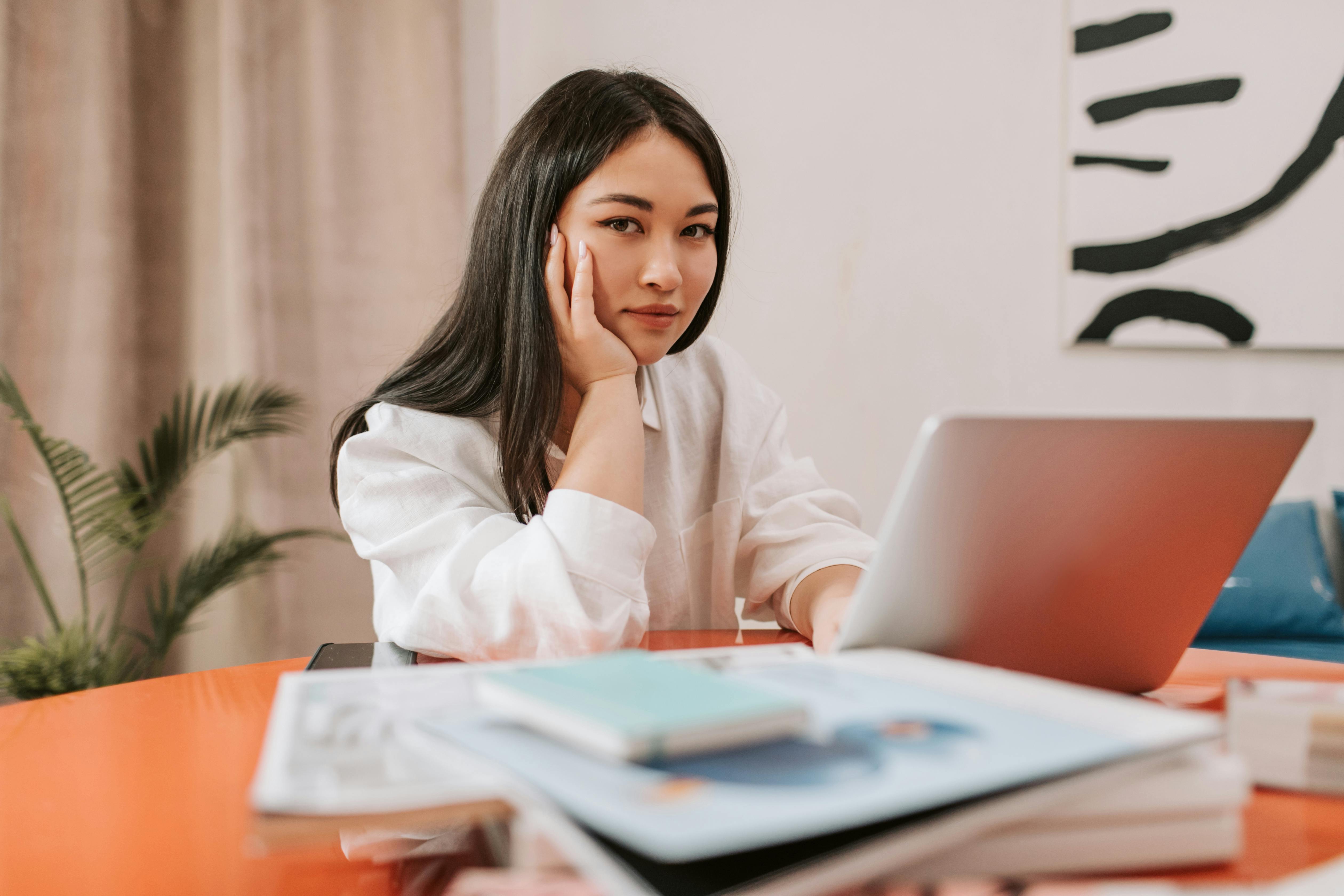 Professional working at a laptop, highlighting increased response rates with a personalized link in bio.