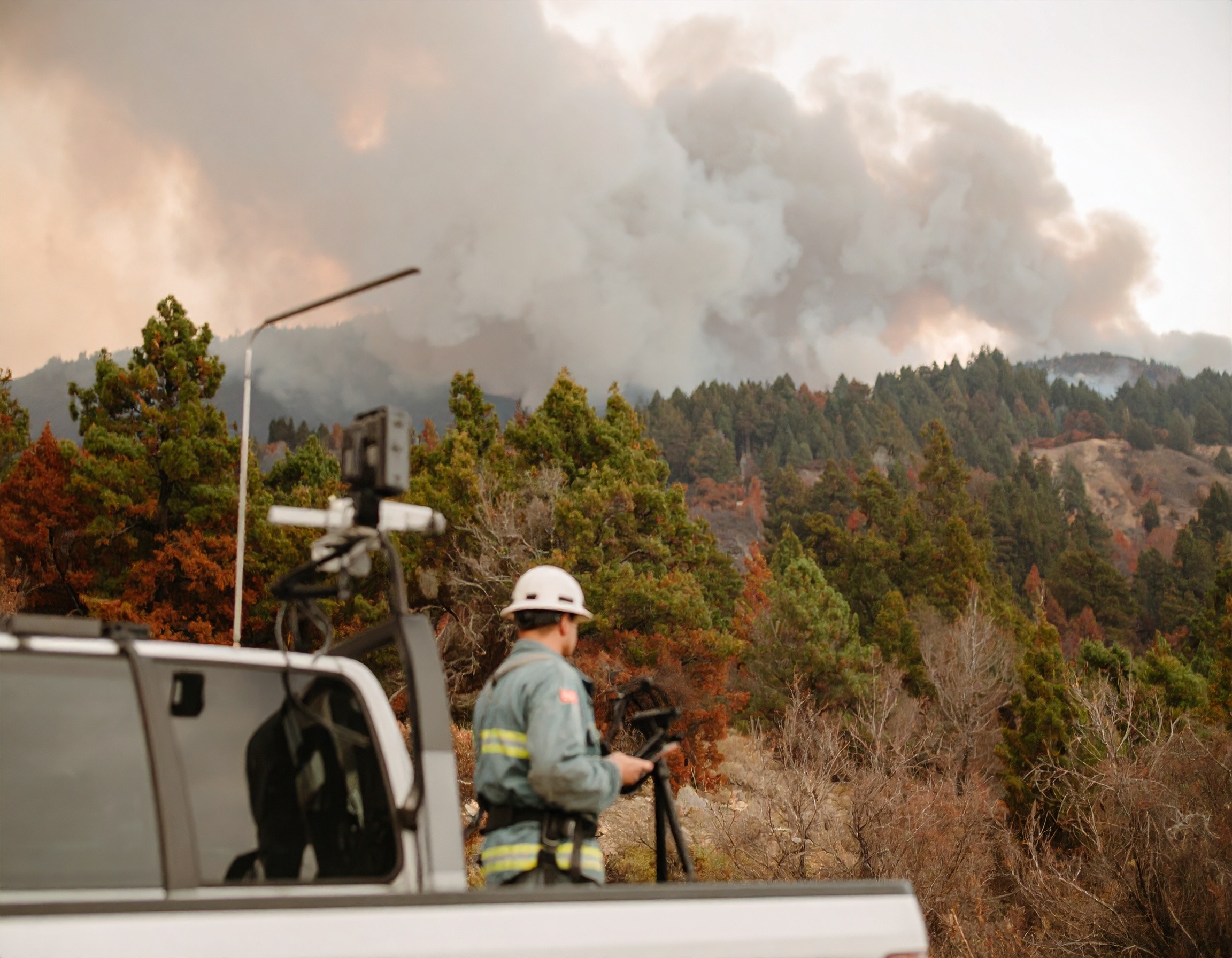 wildfire operative examining sensor