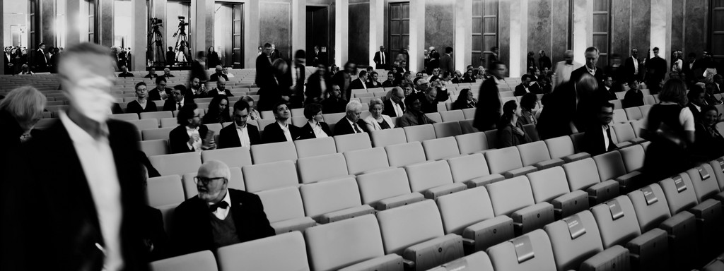 Long exposure shot of a hall filled with people before a performance
