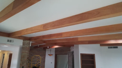 Custom wood-beam ceiling in a Tucson home