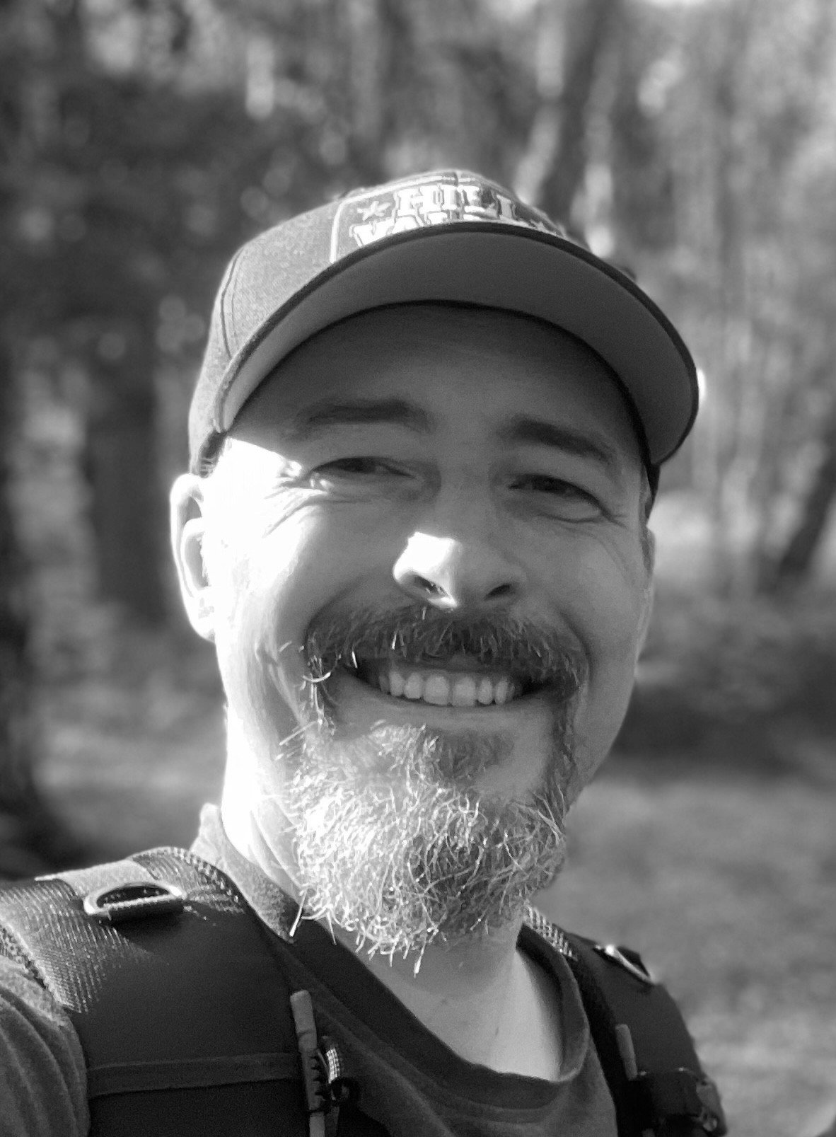 A bearded smiling Englishman