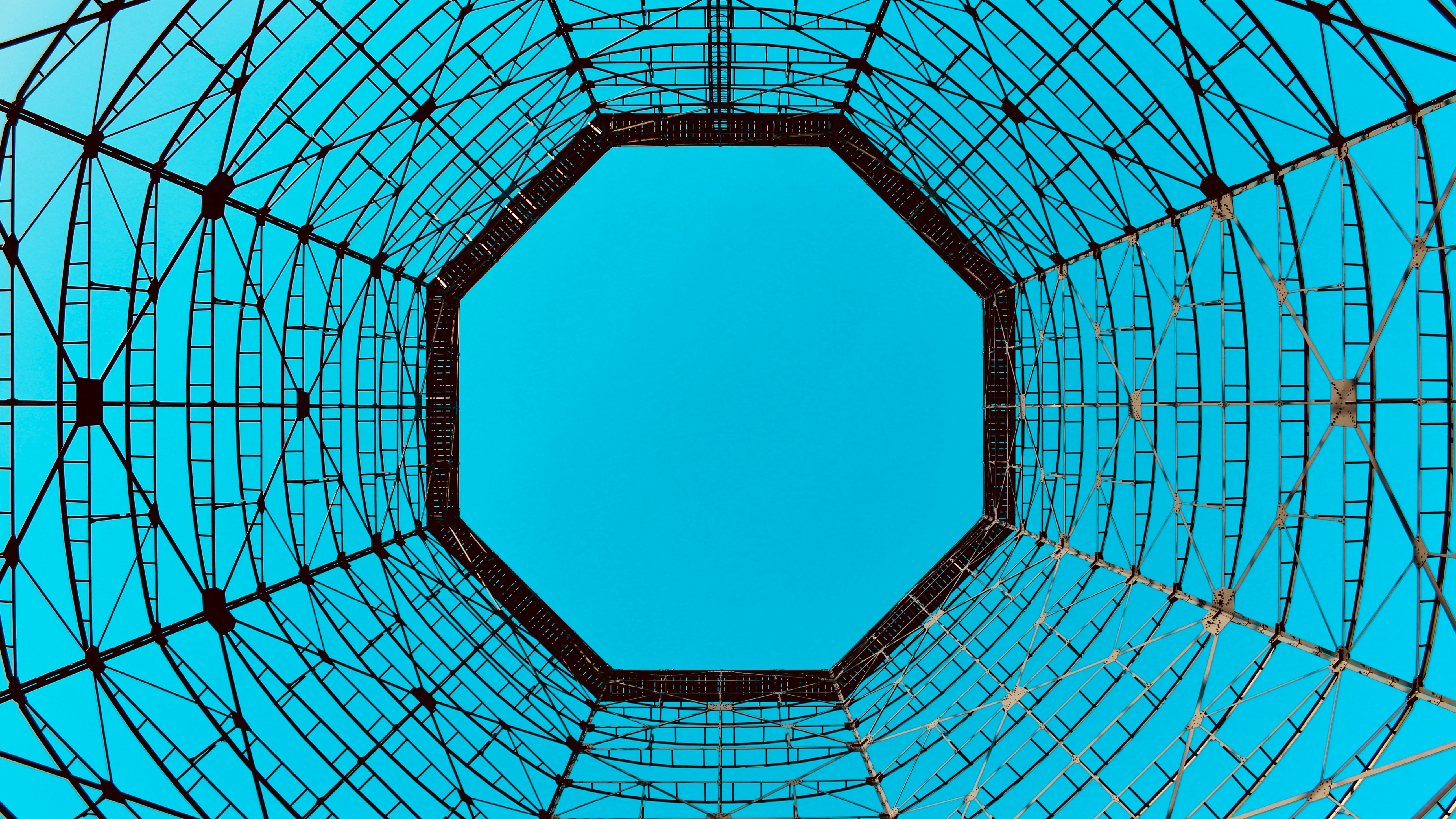 low angle photo of blue sky under circular tower