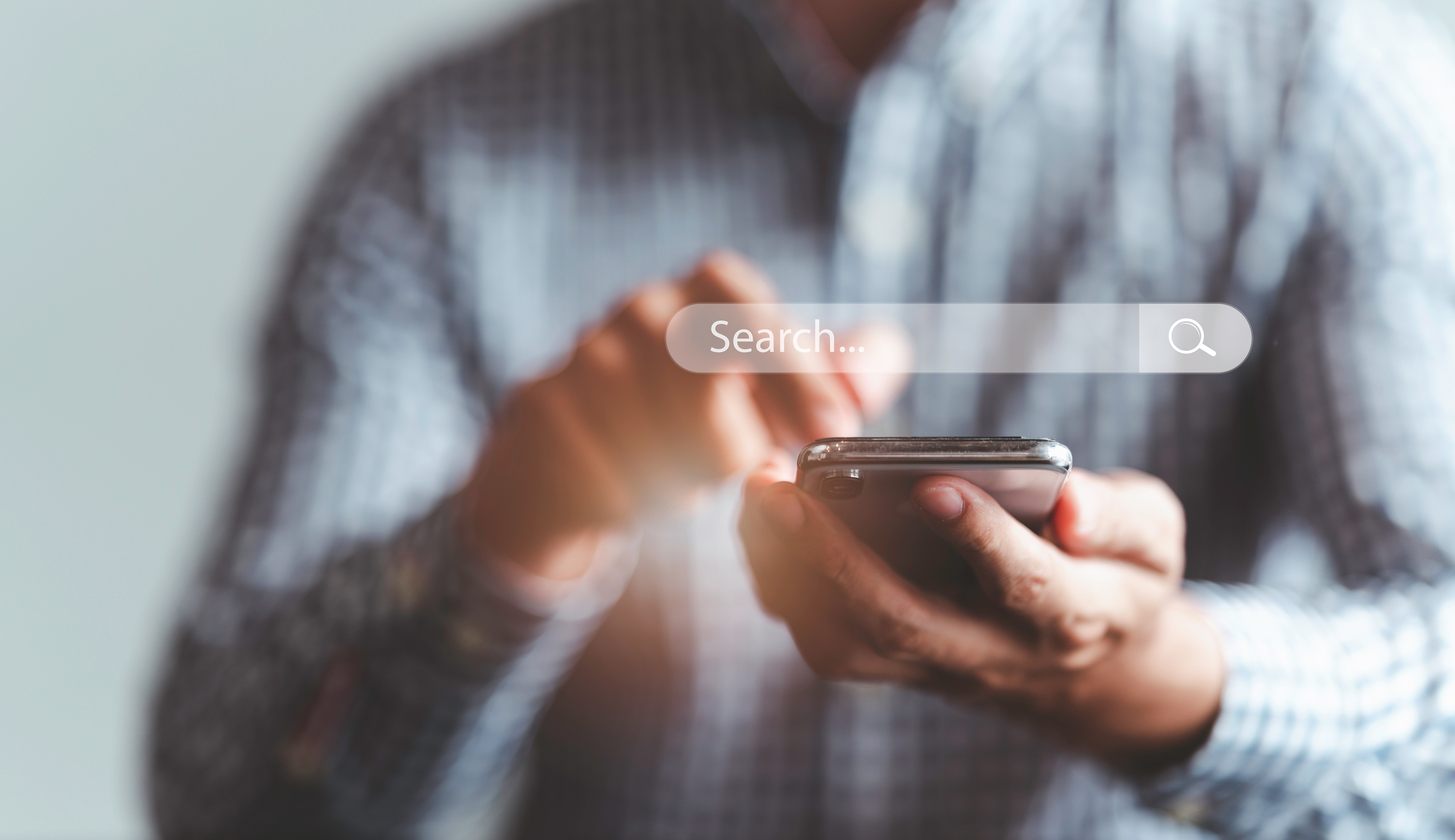 Image of a client searching online for “lawyers near me” on a smartphone.