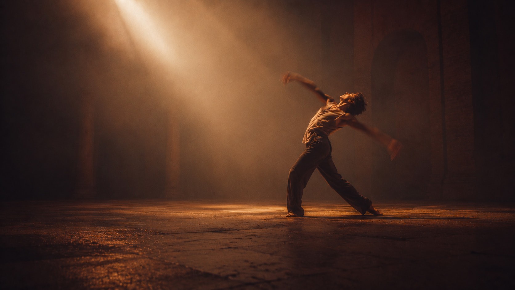 Bathed in a shaft of warm light, the dancer’s body becomes a conduit between shadow and illumination, transforming movement into an act of release. The dramatic contrast and sweeping gesture evoke a moment of transcendence, as though the figure is reaching beyond the physical toward something unseen yet deeply felt.