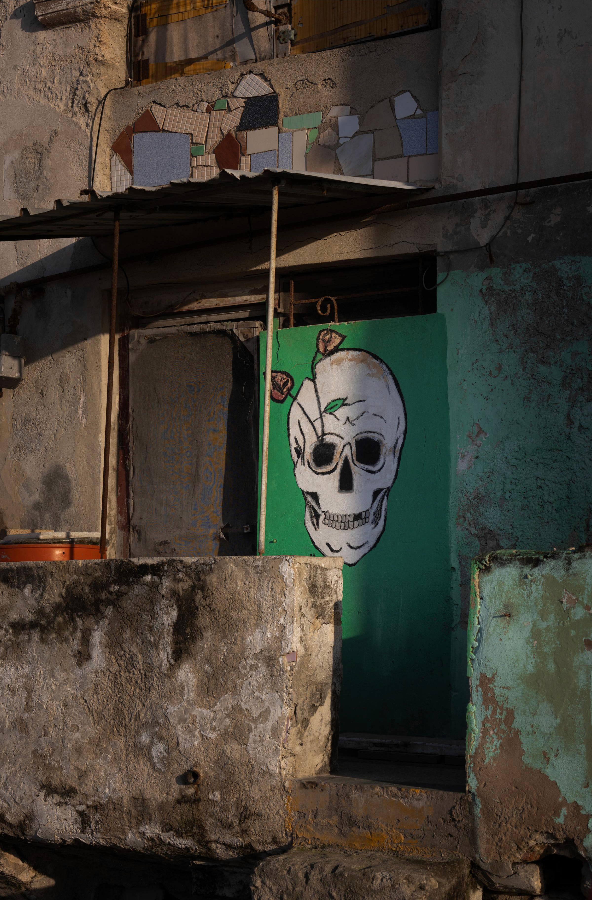 Skull painting at a doorway