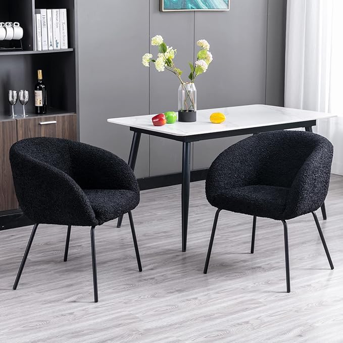 The black barrel dining chair is a stylish addition that complements any interior design.