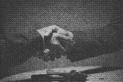 two people shaking hands over a wooden table