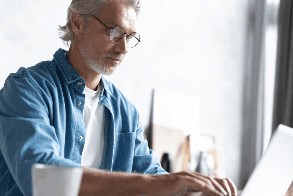 Man typing on computer