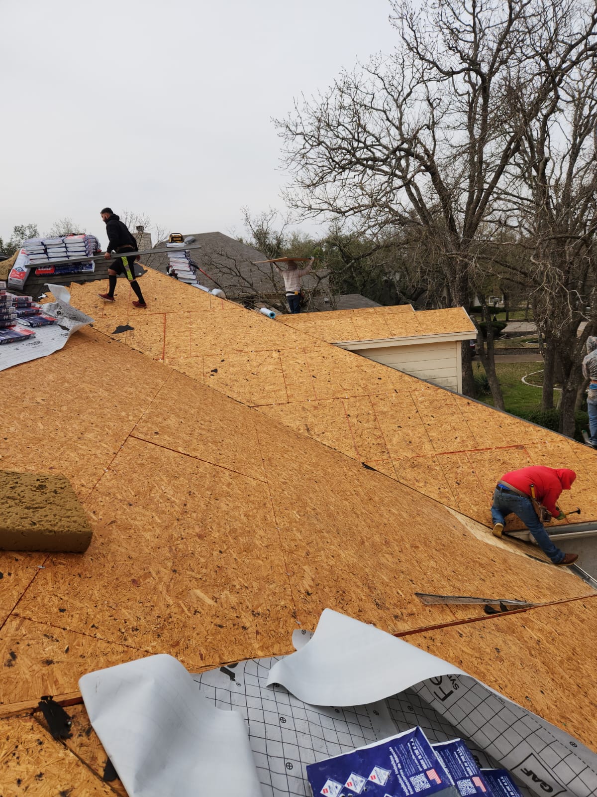 Installing new underlayment before the shingles. 