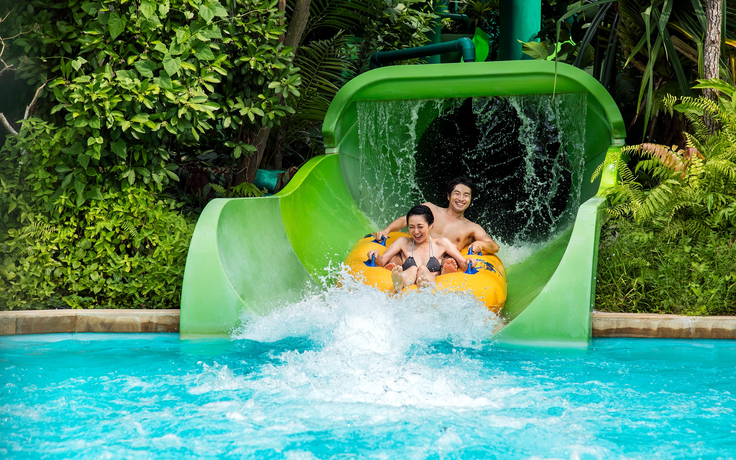 Visitors on the Tidal Twister ride at Adventure Cove Waterpark, Singapore.