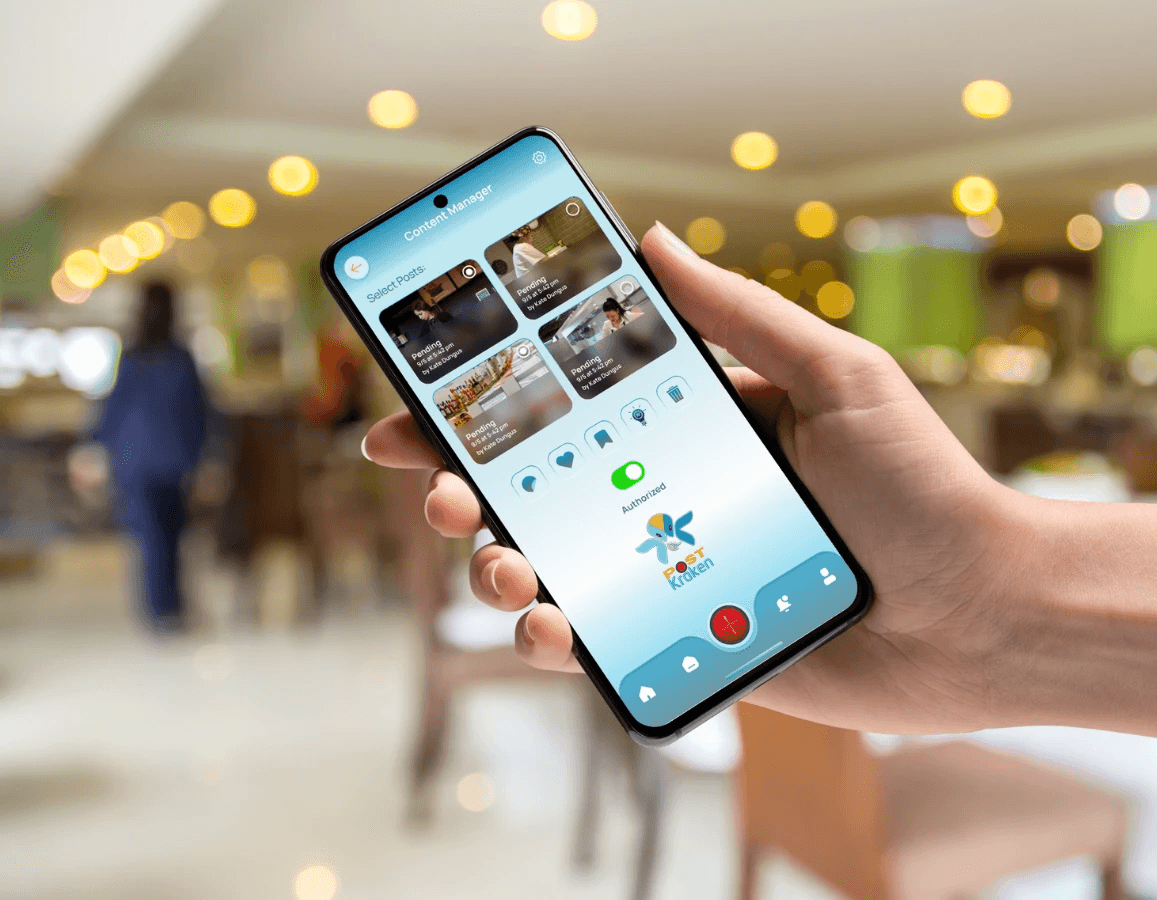 holding phone showing Post Kraken App