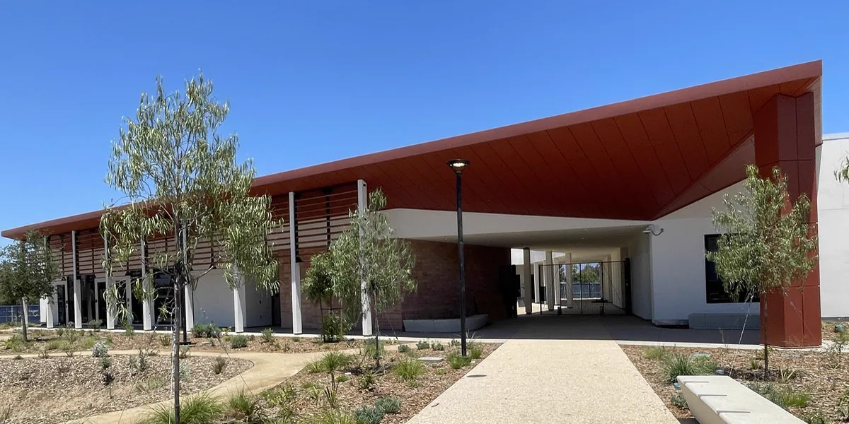 a living room filled with furniture and a mirror
