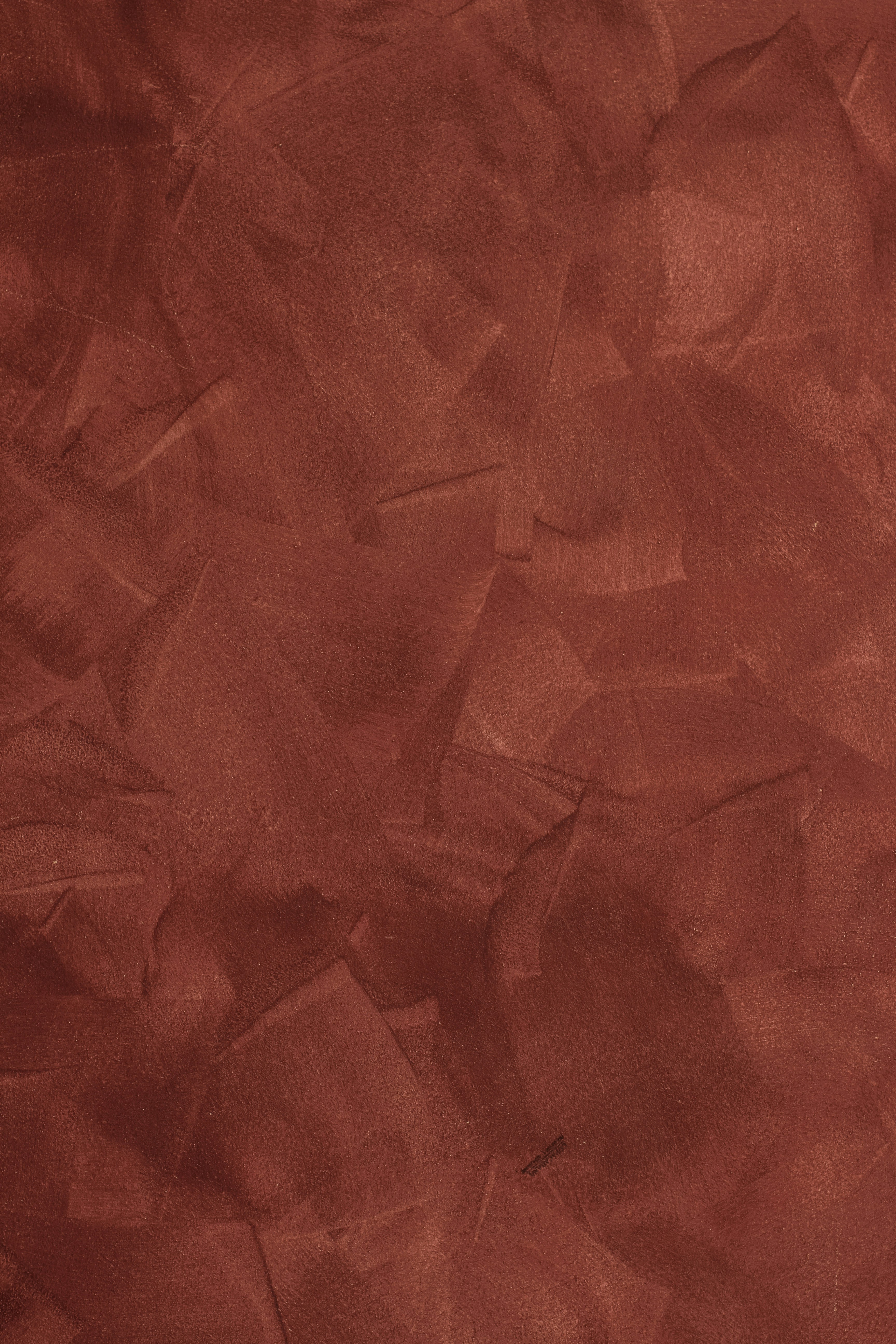 a red background with a rough texture of paper