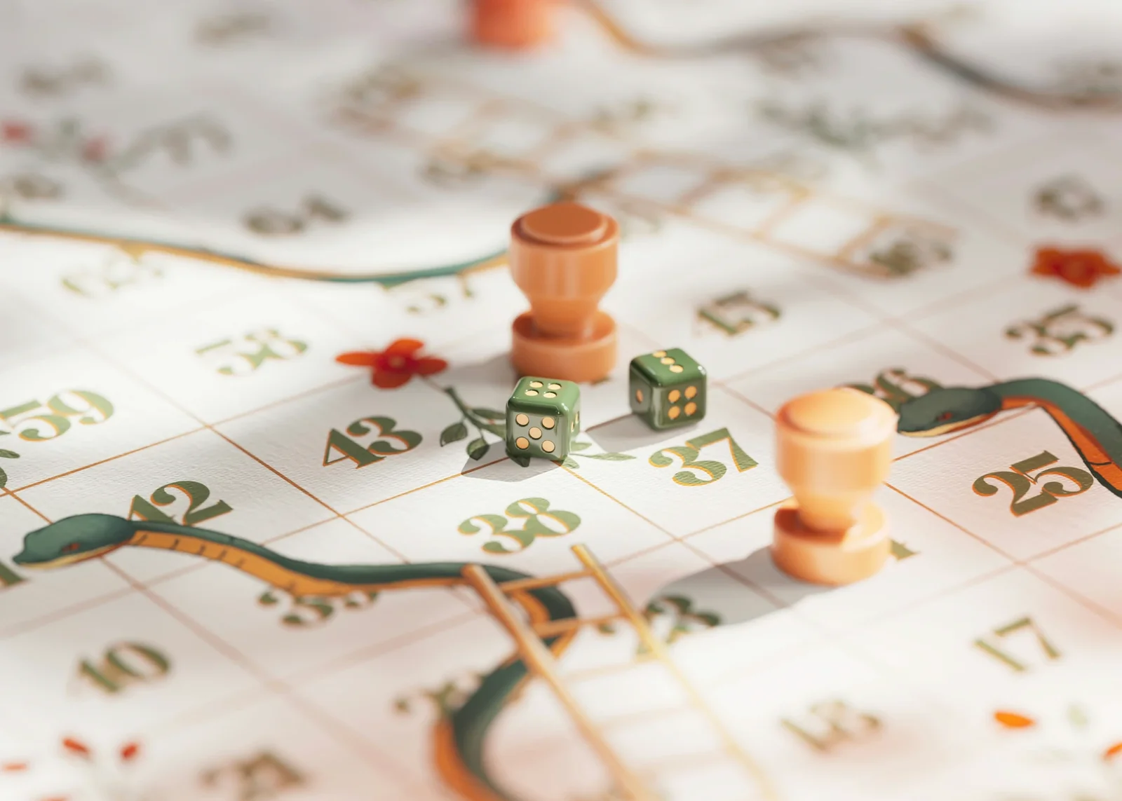 Board game with green dice, orange game pieces, and numbered squares illustrating gamification mechanics.