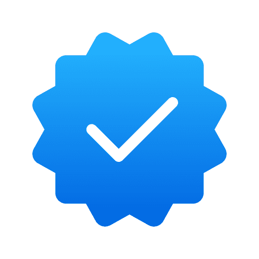 Símbolo de verificación azul con check blanco, indicando que el perfil ha sido autenticado en NudesVIP.