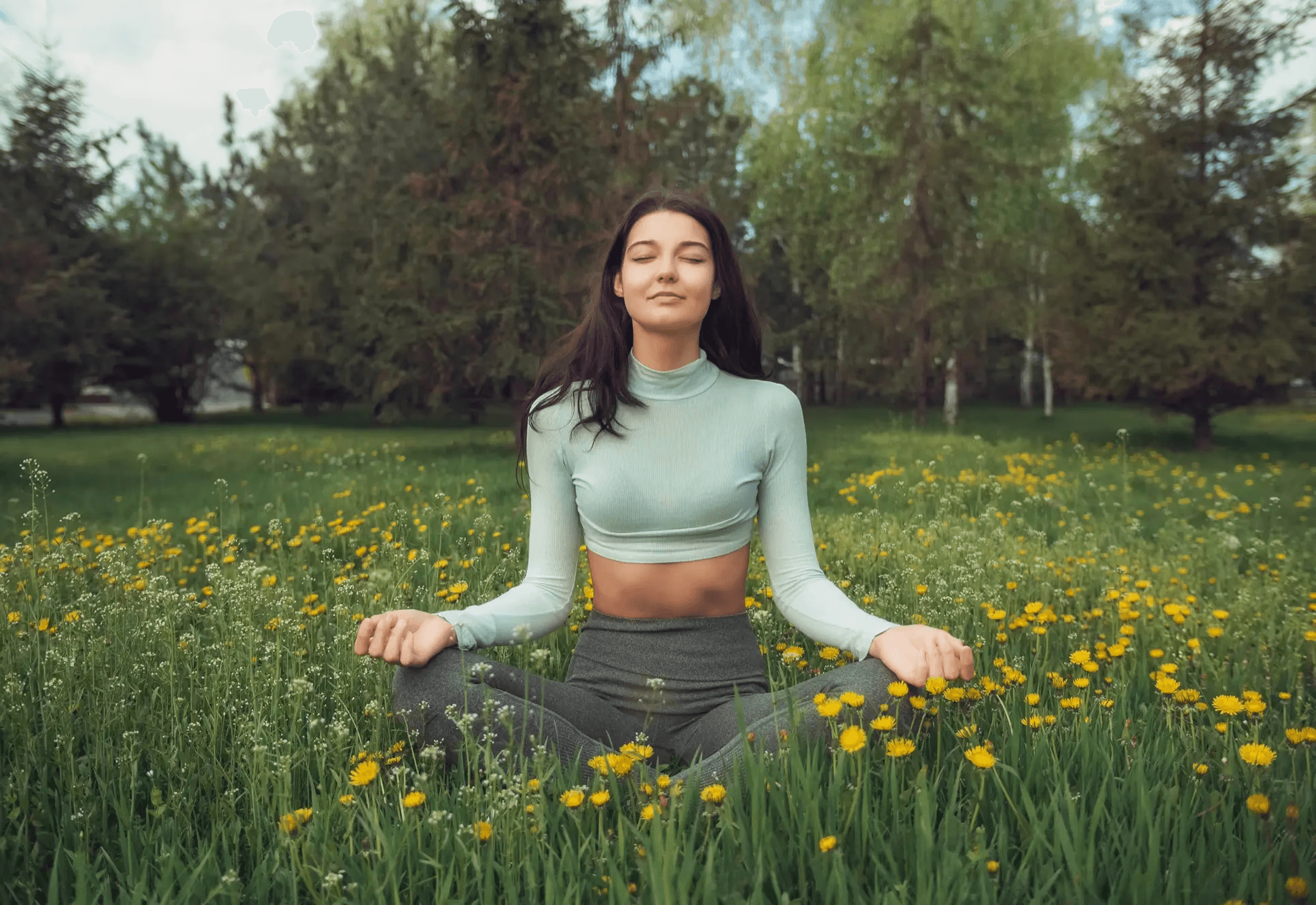 woman wearing gray long-sleeved shirt facing the sea