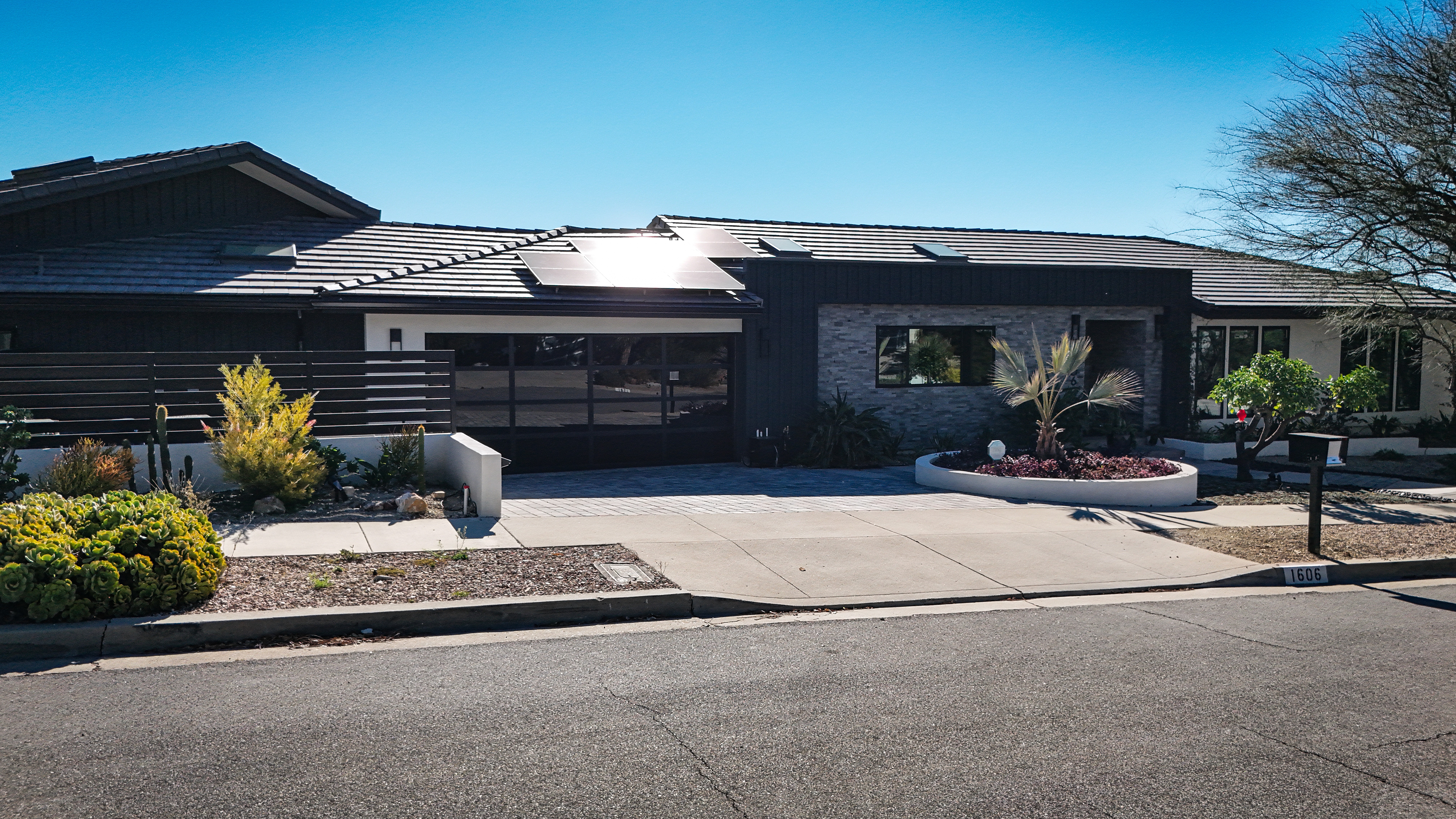 Living room with pocketing open slider doors creating a seamless transition to the outdoors.