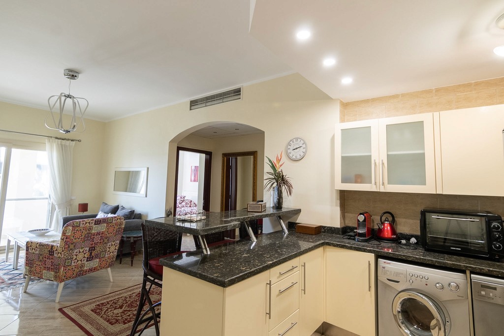 brown wooden house with green grass field