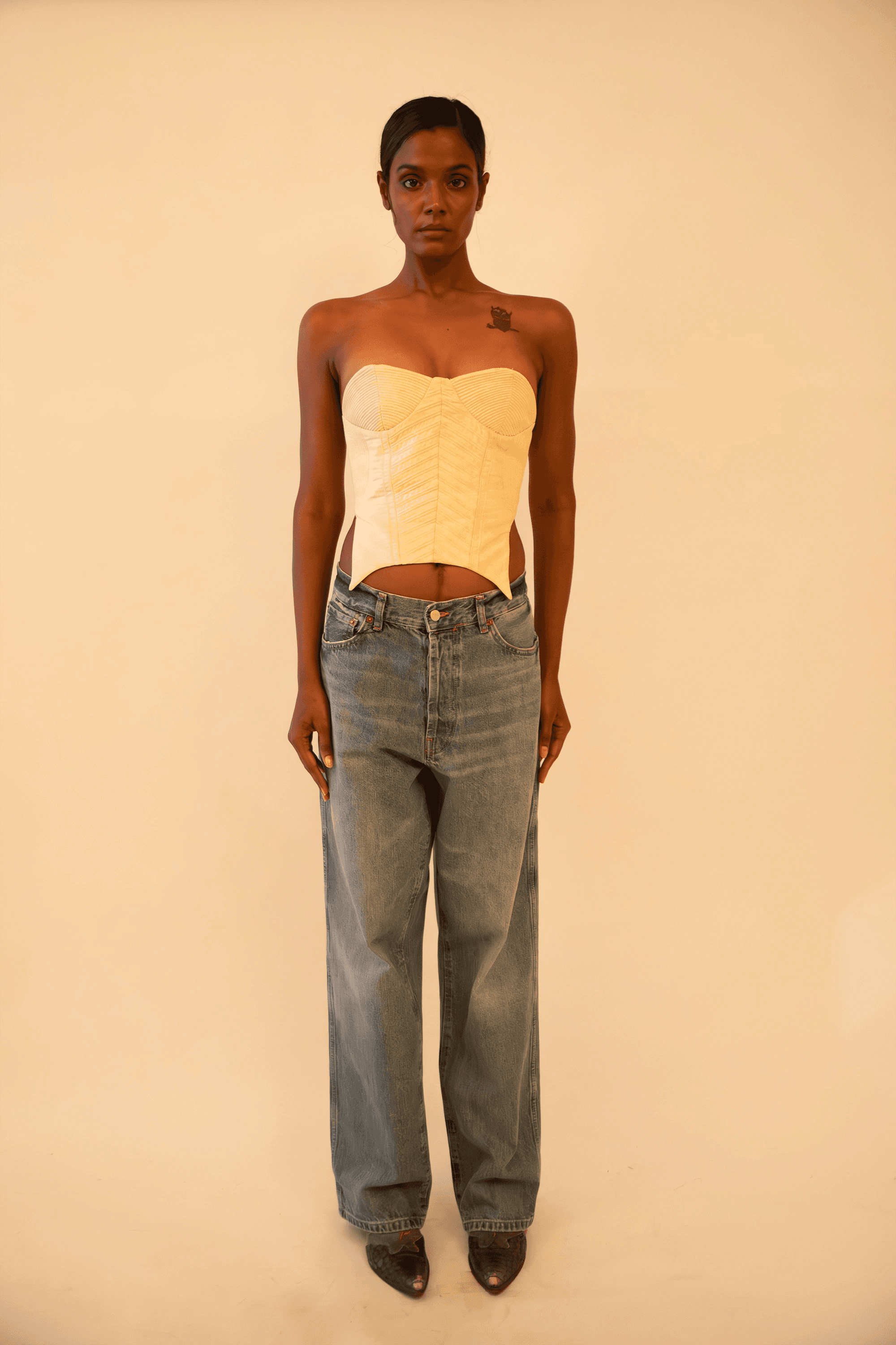 Off-white strapless corset featuring cording detail, handcrafted from upcycled vintage fabric, designed for a structured fit and conscious style