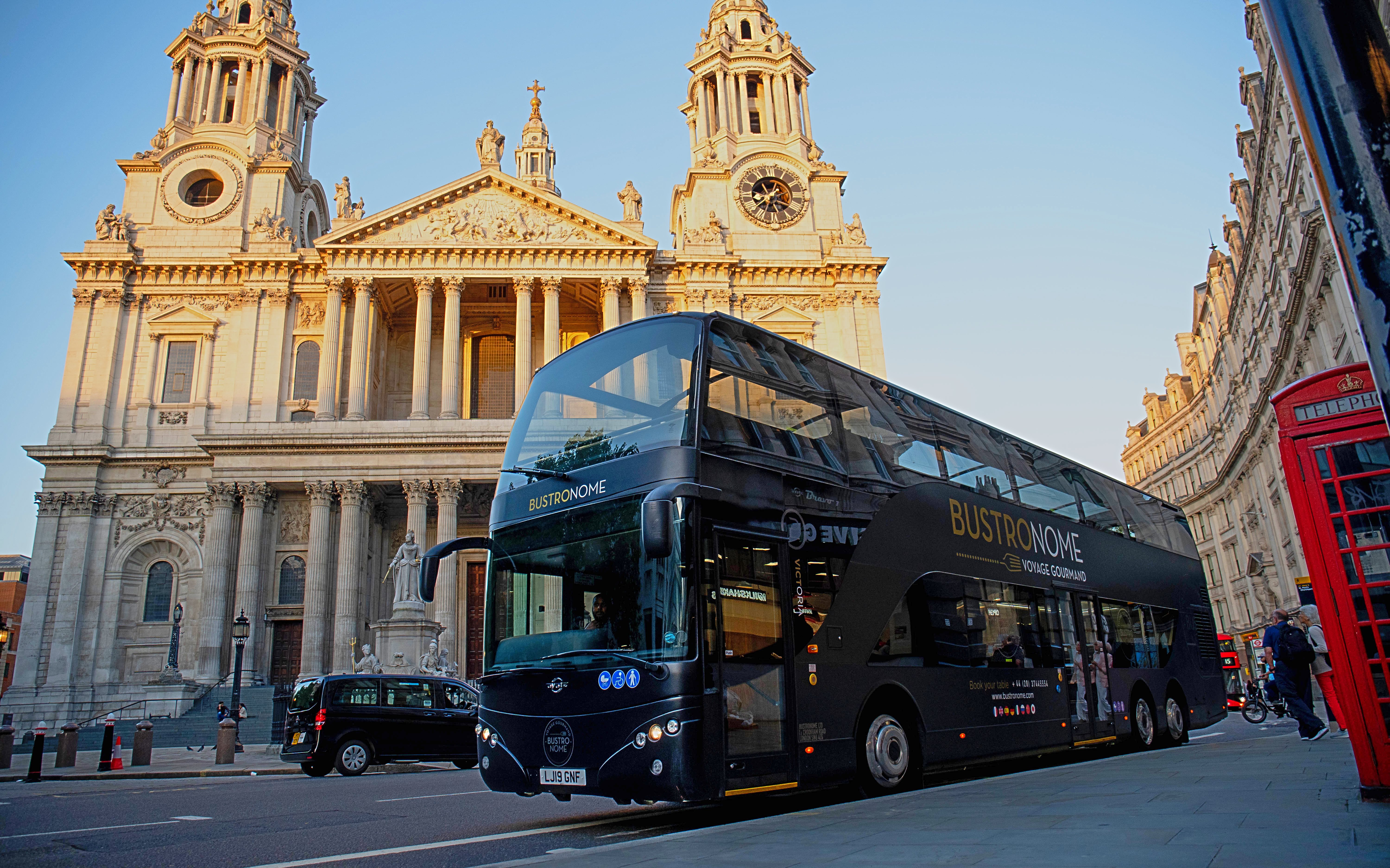Bustronome tour bus in front of St. Paul's Cathedral, London.