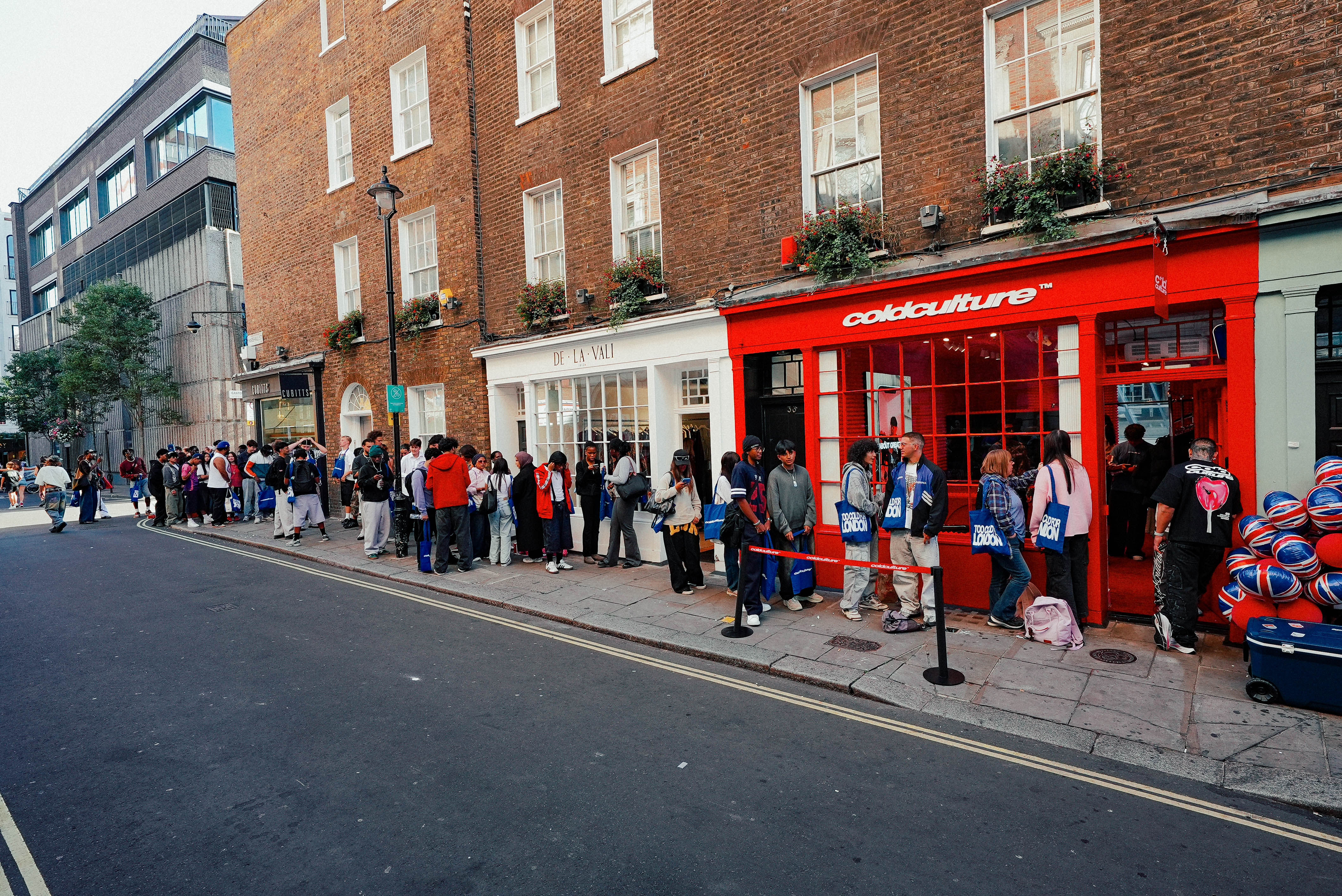 A fast black sports car races down the highway.