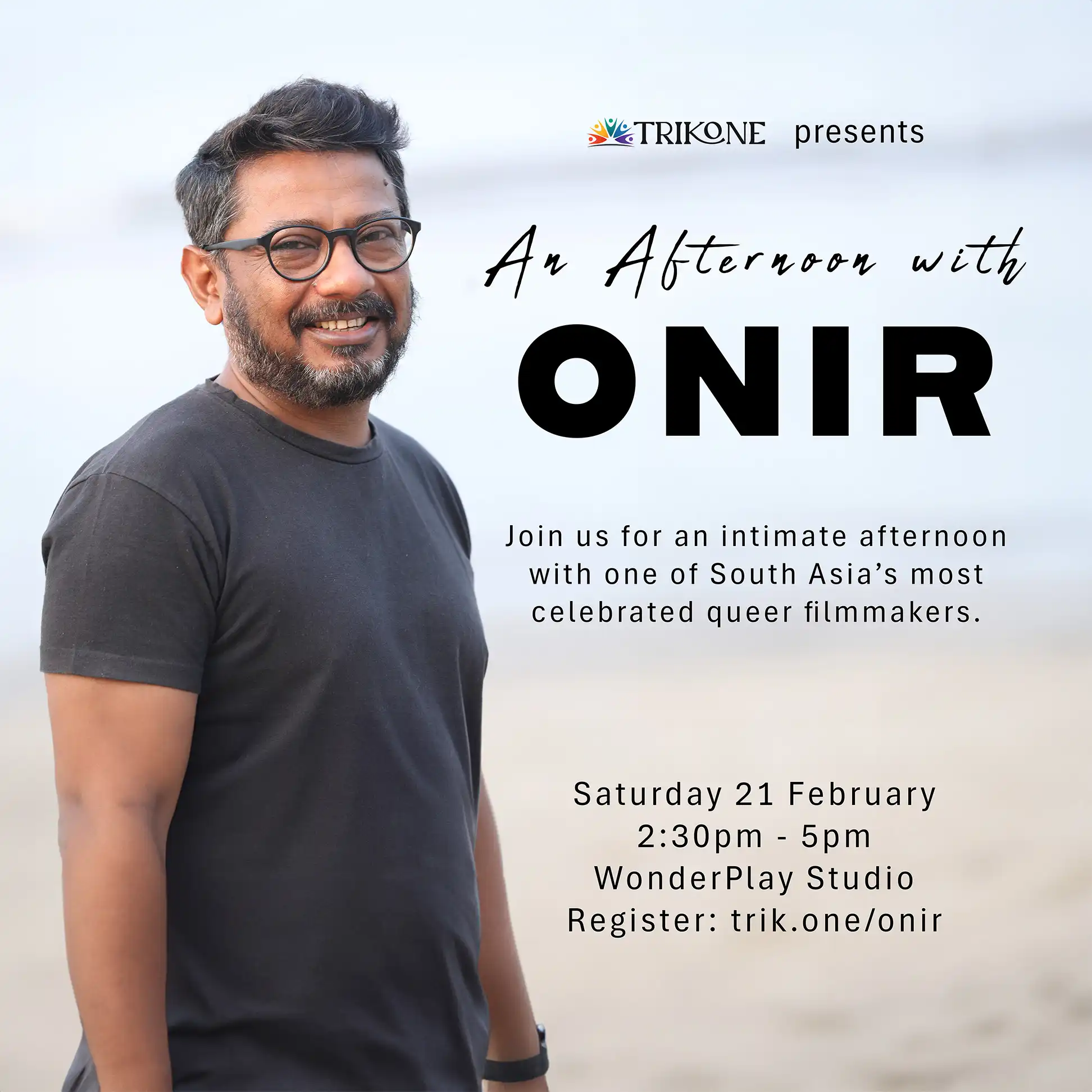 A man with glasses and a beard smiles whilst standing on a beach. Event details text invites guests to “An Afternoon with Onir,” presented by Trikone, on Saturday, 21 February, at WonderPlay Studio.
