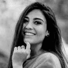 smiling woman wearing white and black pinstriped collared top