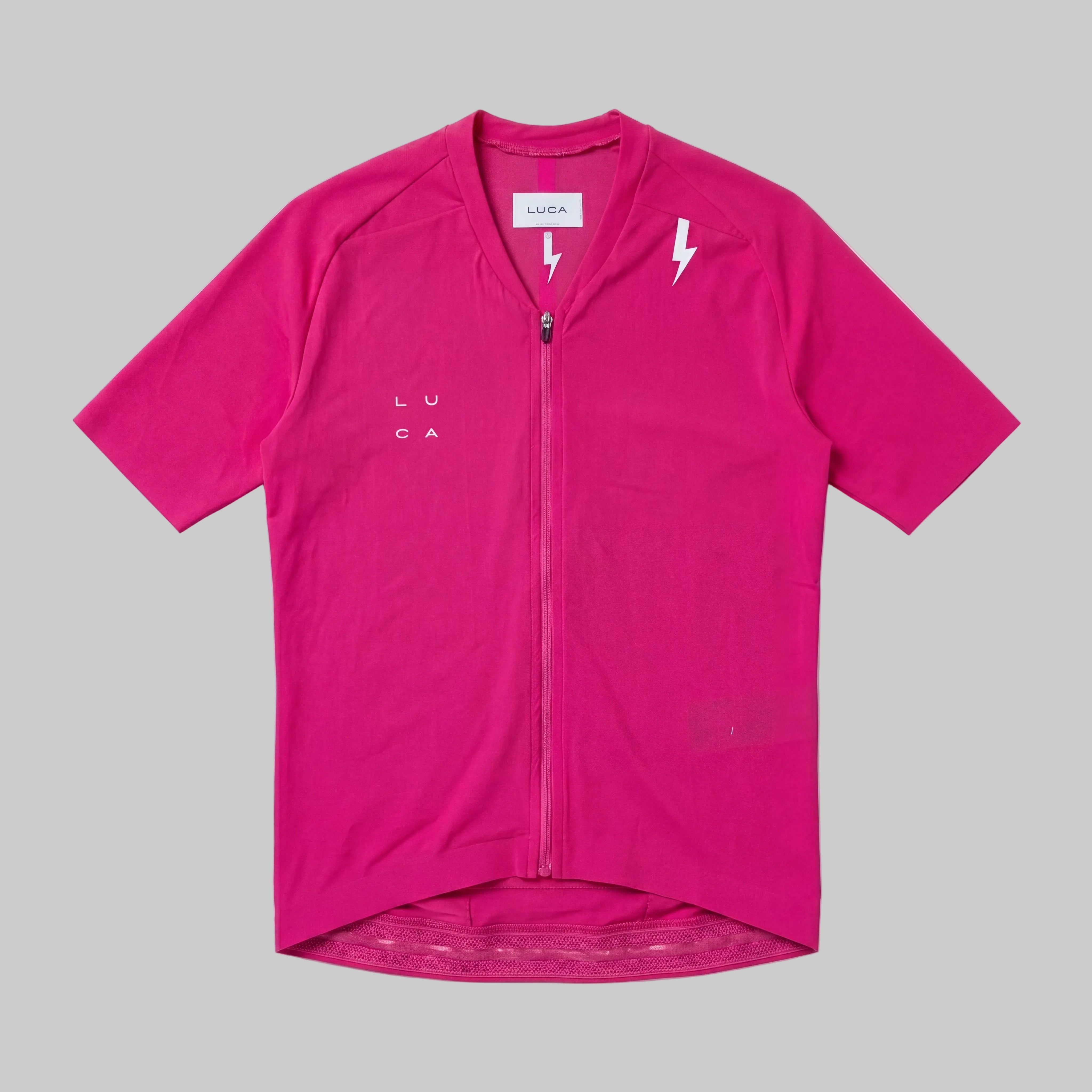 LUCA Soleil women's cycling jersey in hibiscus - front flat lay with V-neckline and bolt detail