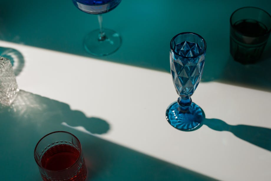 Light casting shadows on glassware