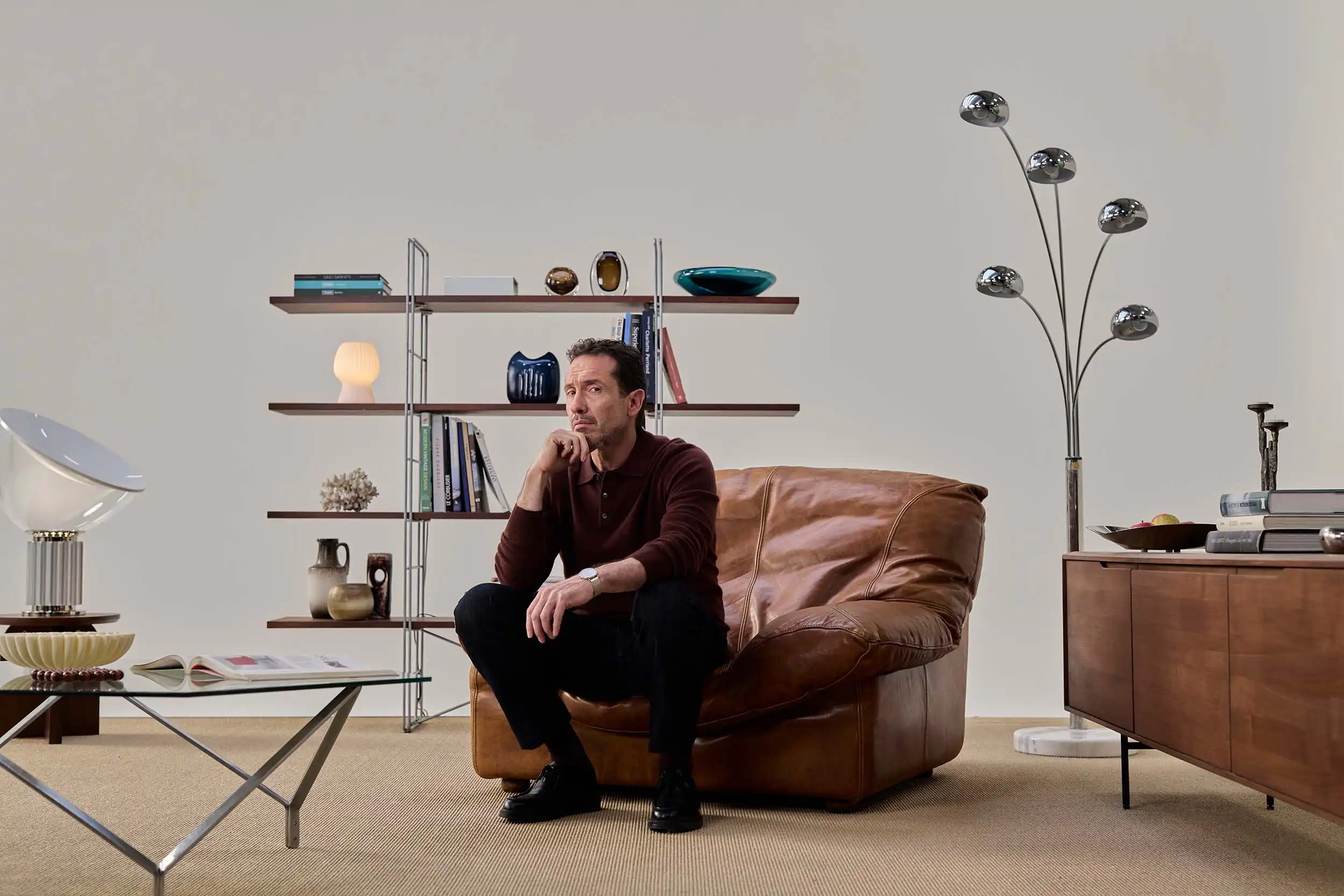 Michiel Spijkers studio portrait photography for Brand New Day, featuring actor Jacob Derwig seated in a book-lined living-room set.