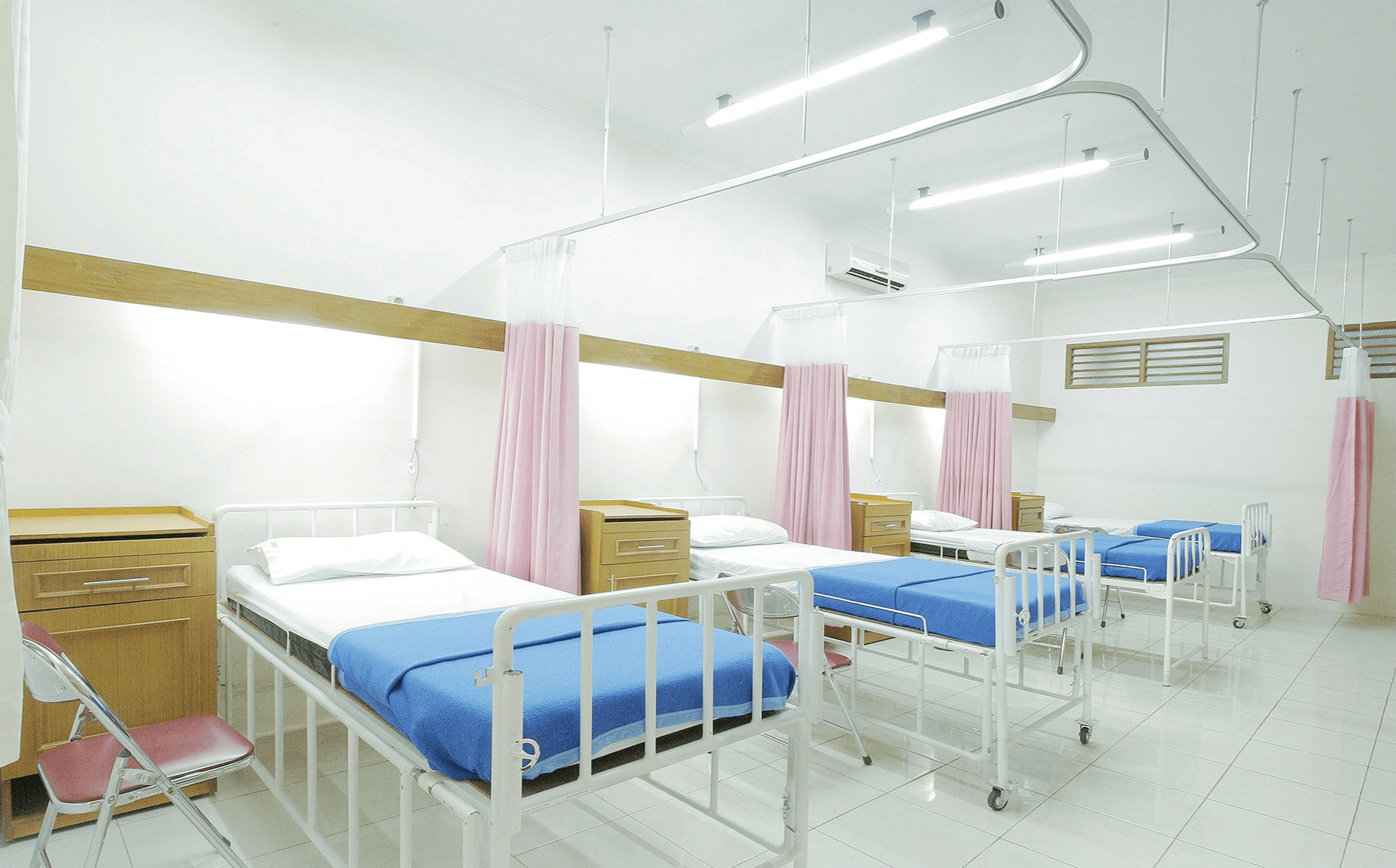 empty hospital bed inside room